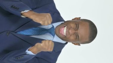 Vertical Video of Young African Businessman Celebrating Achievement on White Background