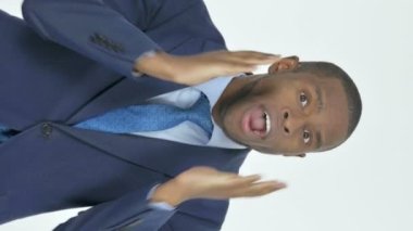 Vertical Video of Young African Businessman Reacting Loss on White Background