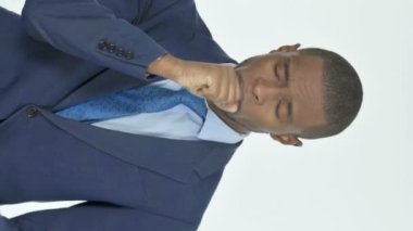 Vertical Video of Coughing Young African Businessman on White Background