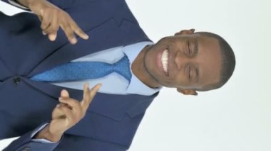 Vertical Video of Dancing Young African Businessman on White Background