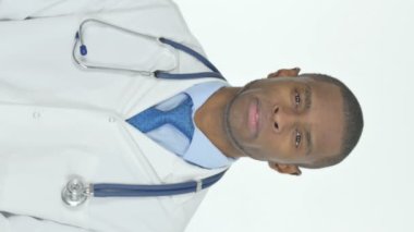 Vertical Video of Serious Young African Doctor on White Background