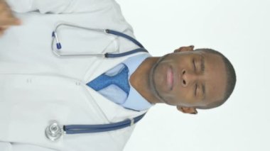 Vertical Video of Denying Young African Doctor Disapproving on White Background