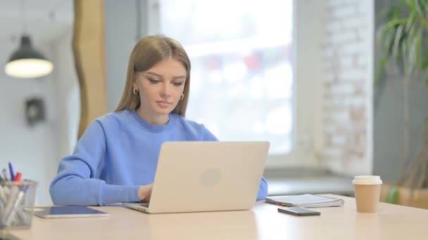 Young Woman Shaking Head Approval While Working Laptop — Stock Video