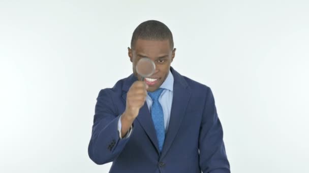 Young African Businessman Searching Loupe White Background — Vídeo de stock
