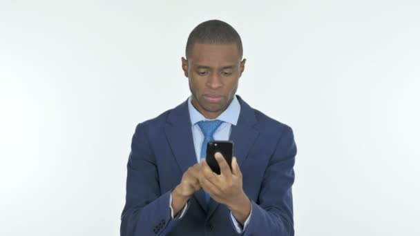 Young African Businessman Loss Smartphone White Background — Video Stock