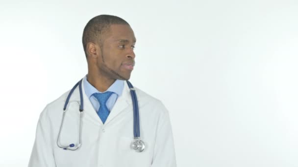 Young African Doctor Pointing Side White Background — Stockvideo