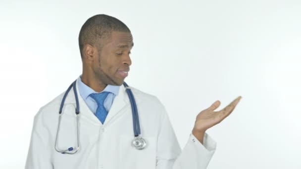 Young African Doctor Showing Side White Background — Video