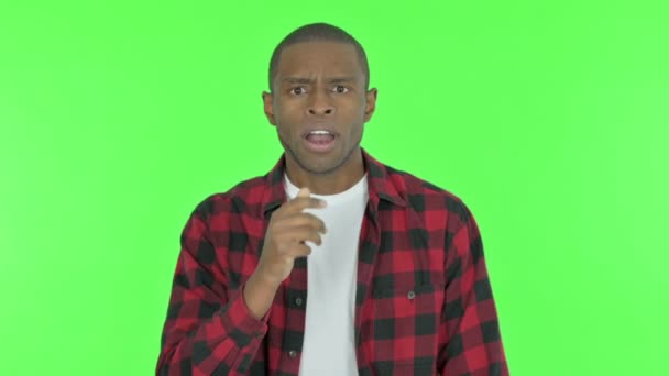 Surprised Young African Man Wondering Green Background — Videoclip de stoc