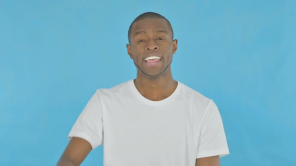 Young African Man Waving Hand Say Hello Blue Background — Wideo stockowe