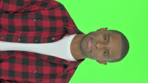 Vertical Video Approval Young African Man Shaking Head Green Background — Stockvideo