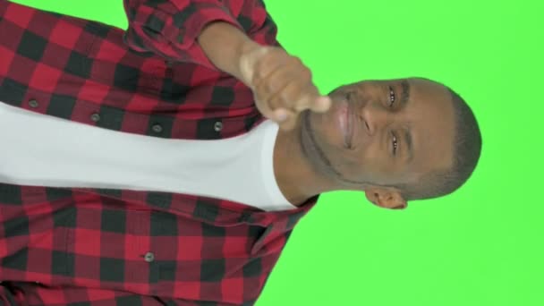 Vertical Video Young African Man Pointing Camera Green Background — Video Stock