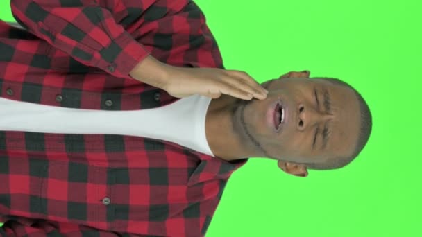 Vertical Video Young African Man Having Toothache Green Background — Stockvideo