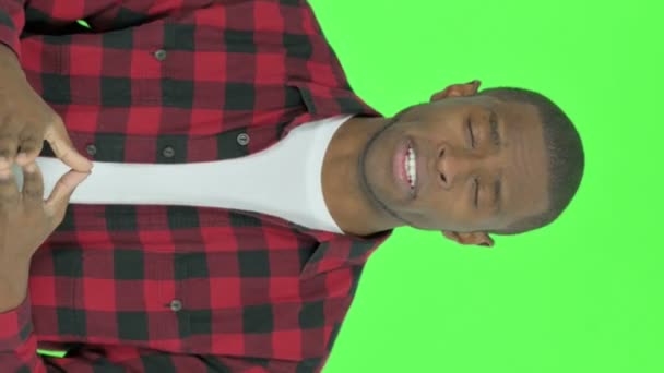 Vertical Video Talking Young African Man Green Background — Wideo stockowe