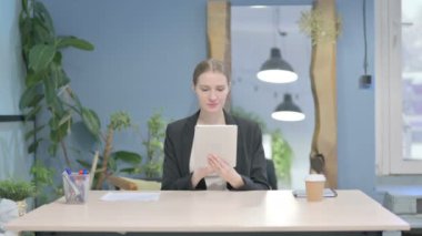 Young Businesswoman using Digital Tablet, Browsing Internet