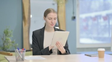 Young Businesswoman using Digital Tablet, Browsing Internet