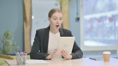 Young Businesswoman Cheering Win on Digital Tablet