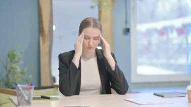 Tired Young Businesswoman with Headache at Work, Migraine