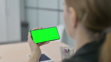Young Businesswoman Watching Smartphone with Chroma Key