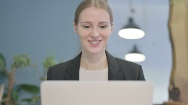 Close Up of Young Businesswoman Doing Video Chat on Laptop
