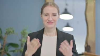 Portrait of Inviting Young Businesswoman in Office