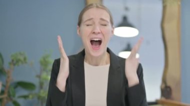 Distraught Young Businesswoman Screaming in Stress