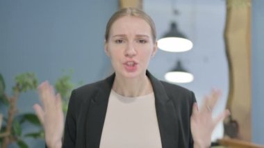 Distraught Young Businesswoman Talking in Anger and Stress