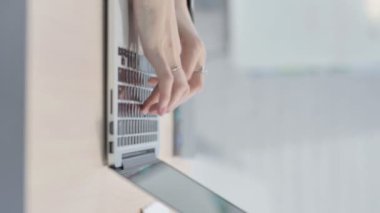 Vertical Video of Female Hands Typing on Laptop