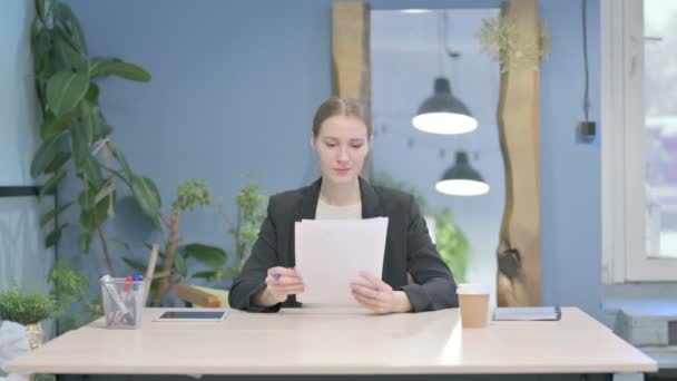 Young Businesswoman Reading Documents Office Paperwork — Stock Video