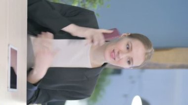 Vertical Video of Young Businesswoman Talking on Phone