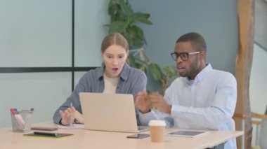 Multiethnic Business People Reacting to Loss at Work