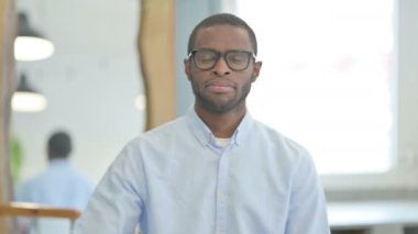 Portrait of Thumbs Down by African American Man