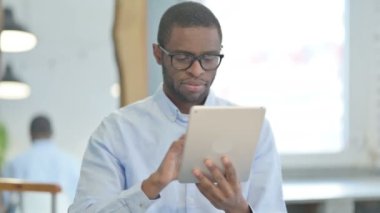 Portrait of African American Man using Tablet