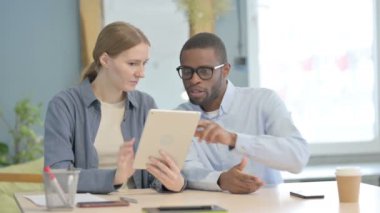 Multiethnic Business People Browsing Tablet Together