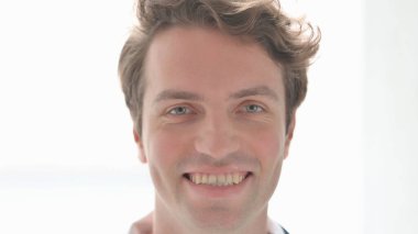 Face Close Up of Smiling Casual Young Man