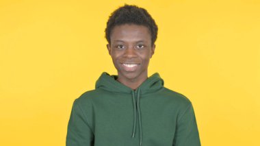 Smiling Casual African Man on Yellow Background