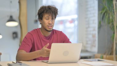 Young African Man Doing Online Video Chat in Office