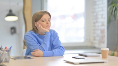 Tired Young Woman Sleeping Sitting in Office