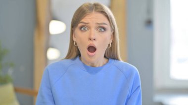 Shocked Young Woman Wondering in Awe, Astonished
