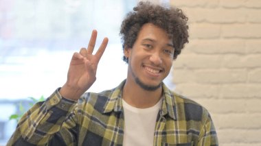 Portrait of Young African Man with Ok Sign