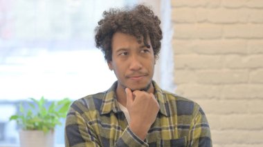 Portrait of Pensive Young African Man Thinking New Plan