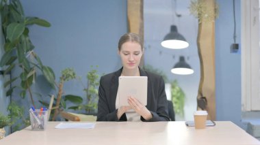 Young Businesswoman using Digital Tablet, Browsing Internet