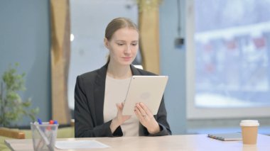 Young Businesswoman using Digital Tablet, Browsing Internet