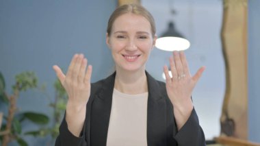 Portrait of Inviting Young Businesswoman in Office