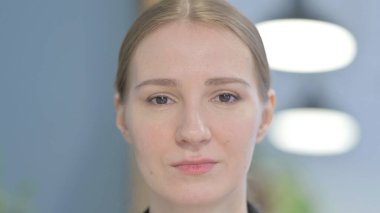 Close Up of Serious Young Businesswoman Face