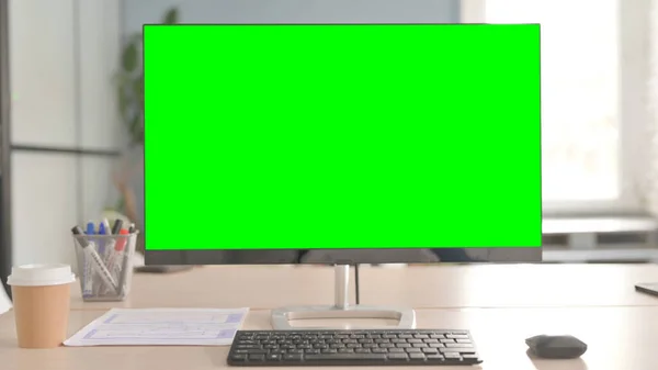 Monitor with Green Chroma Key in Office