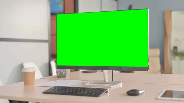 Computer with Green Screen in Office