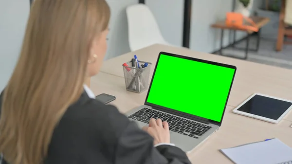 Businesswoman Using Laptop with Green Screen