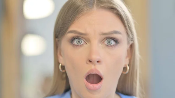 Close Up of Shocked Young Woman Wondering Face