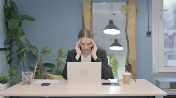 stock image Young Businesswoman having Headache while Working on Laptop