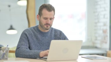 Mature Adult Man Shocked While Working on Laptop